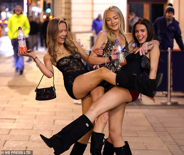 Three young girls in Leeds smile as they prepare to welcome the New Year