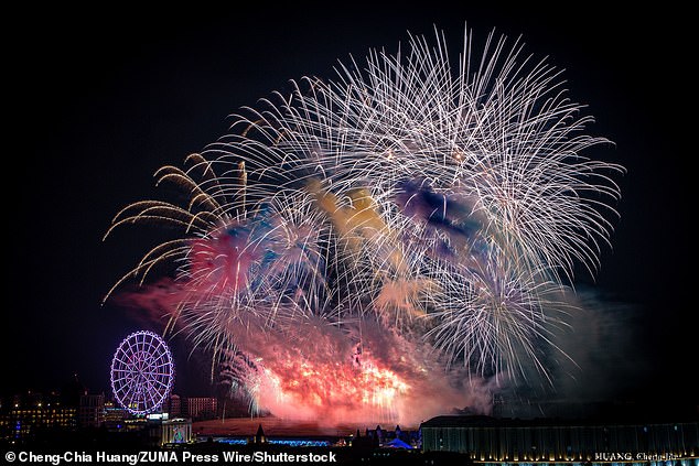 Thousands of fireworks light up the night sky as the Taiwanese celebrate the New Year in Koahsiung City