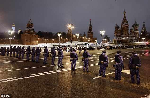 Russian policemen create a blockade during the New Year celebration near the Red Square in Moscow