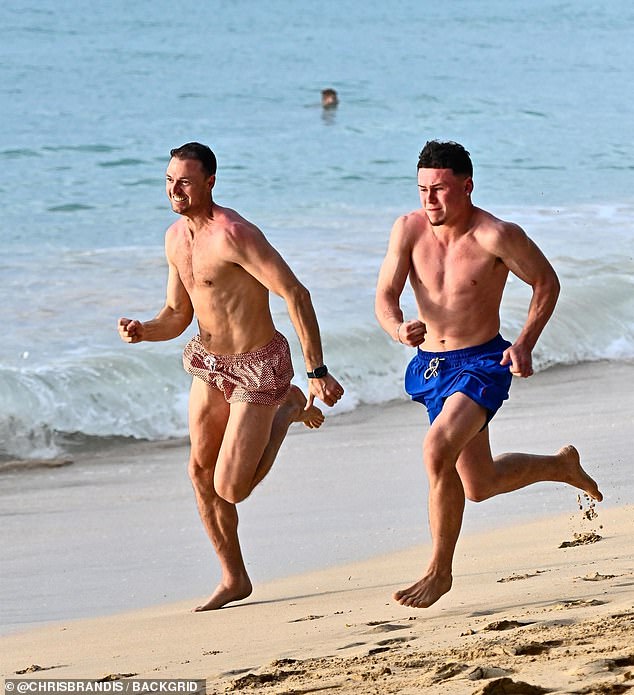 However for once it wasn't Coleen who was the centre of attention as her eldest son Kai, 16, stole the show as he raced across the beach with Jonny Evans