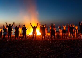 People celebrate the Night of Ancient Bonfires, a tradition practiced along the Baltic coast with Pagan roots.