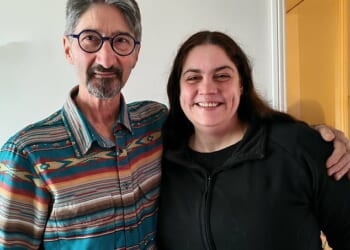 John and his daughter Donna all smiles in a photograph from December 2025. The father has recounted their emotional battle with cancer