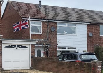 Adam Peaty’s family have fuelled speculation of a bitter rift by flying a Union Flag upside down while staying hundreds of miles from his wedding where they were notably absent