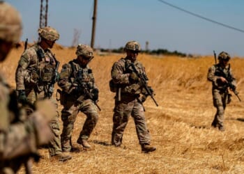 US soldiers walk with Turkish troops in the Syrian village of al-Hashisha on Sept. 8, 2019.