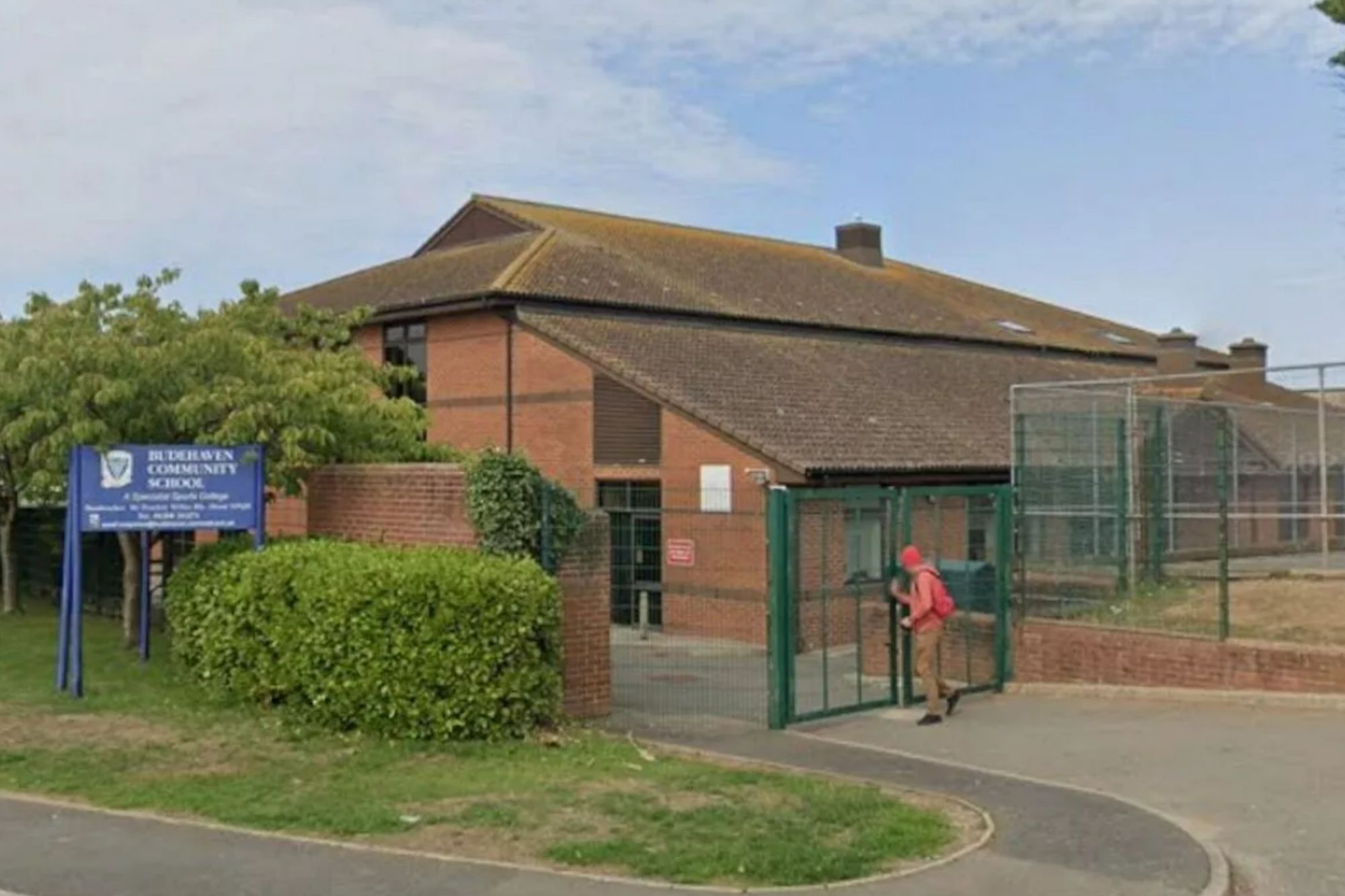 An image collage containing 1 images, Image 1 shows Budehaven Community School exterior with a sign and a person opening a gate