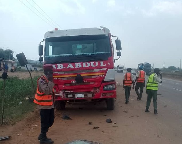 A truck pictured at the side of the road following the fatal collision in Nigeria on Monday