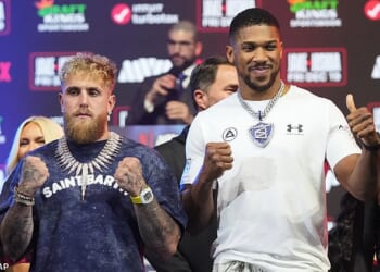 Jake Paul, left, and Anthony Joshua face-off during a news conference promoting their upcoming heavyweight boxing match, Wednesday, Dec. 17, 2025, in Miami Beach, Fla. (AP Photo/Lynne Sladky)