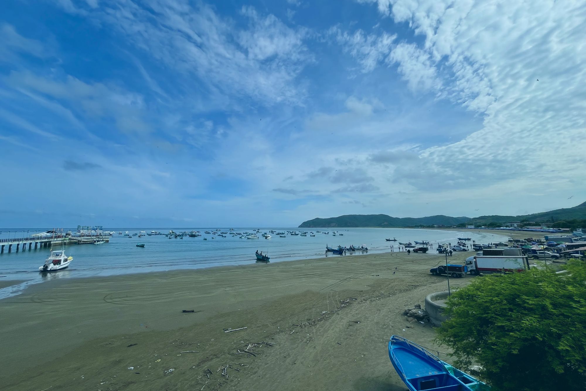 An image collage containing 1 images, Image 1 shows Fishing boats filling Puerto Lopez, Machalilla National Park, Manabí, Ecuador