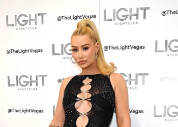 BEACH BUM Iggy Azalea shows off her big butt tattoo in a tiny thong bikini as she hits the beach in her native Australia