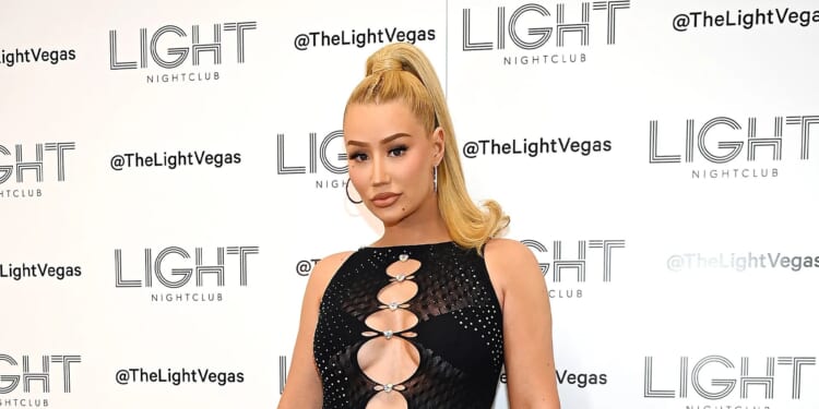 BEACH BUM Iggy Azalea shows off her big butt tattoo in a tiny thong bikini as she hits the beach in her native Australia