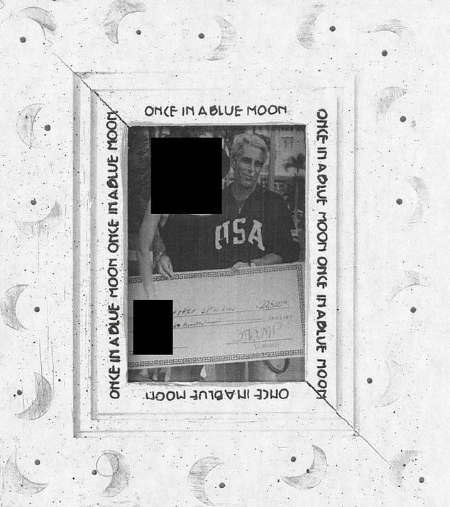 A framed photo in Epstein's home showed the sec offender posing with a check signed by Trump