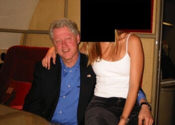 Former President Bill Clinton is seen in an image with a woman as part of the Epstein files that were released on Friday