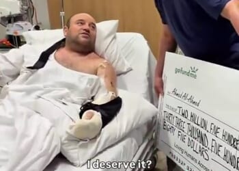Pictured is the moment Mr Al-Ahmed was handed a $2.5million cheque in hospital