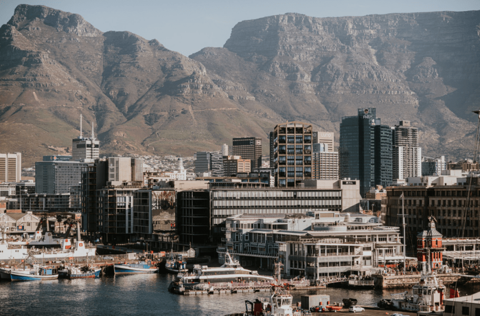 Cape Town harbor and city with Table Mountain in the background.