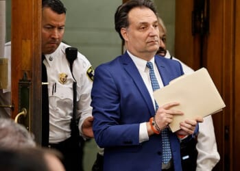 Art fraudster Brian Walshe enters the courtroom in Norfolk Superior Court in Dedham for opening statements in his murder trial