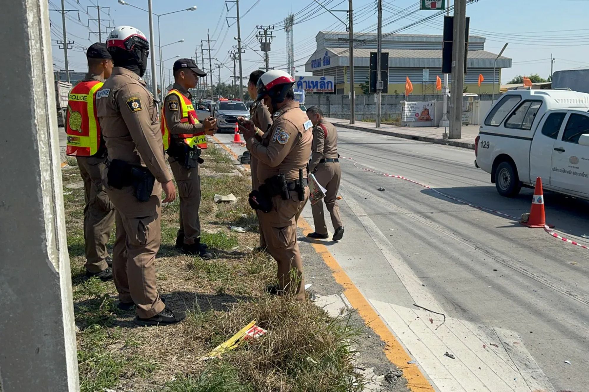 An image collage containing 1 images, Image 1 shows Thai police investigate a fatal car accident on a road in Thailand