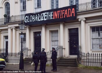 A banner carrying the slogan 'globalise the intifada' in Regent's Park, central London