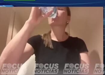 Zulma Guzman Castro drinks from a bottle of Buxton mineral water during an exclusive interview with Focus Noticias