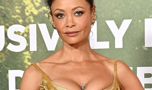 Thandiwe Newton, 53, showed off her collection of tattoos at the world premiere of Anaconda, in Los Angeles which included a heart on her chest, a smiley face, and two quotes on her arms