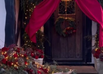 Stacey Solomon spruced up her front porch with a huge red bow at the door - as well as a faux sleigh, laden with shrubbery