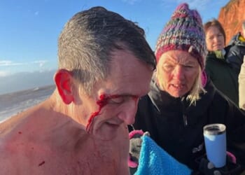Mike Brown described how he had to be pulled from the sea by passersby amid the 'worst ever' conditions he had encountered as a swimmer