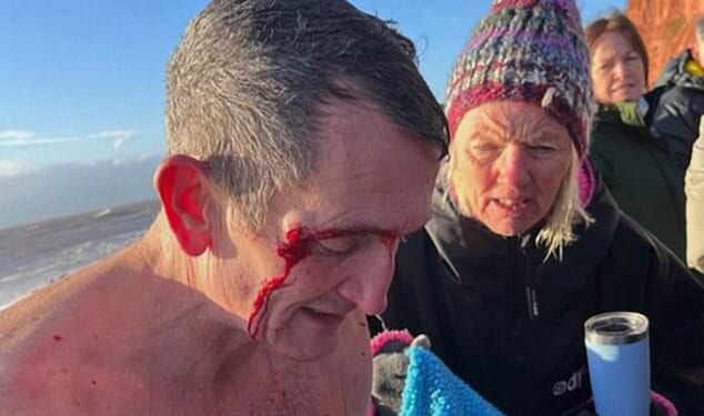 Mike Brown described how he had to be pulled from the sea by passersby amid the 'worst ever' conditions he had encountered as a swimmer