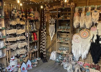 Christmas markets in the UK were once a great destination to find unique gifts from independent sellers - but now, they are more likely to sell 'overpriced tat' that can easily be found on Amazon, Temu and Etsy. Pictured, a stall at Leeds Christmas market