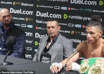 A battered and bruised Andrew Tate (left) following his defeat against Chase DeMoor (right). The self-described misogynist is in Dubai for his fight in the Misfits Mania celebrity boxing match