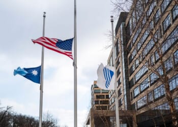 Flags fly at half mast outside the United Healthcare corporate headquarters on Dec. 4, 2024, in Minnetonka, Minnesota.