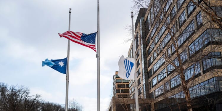 Flags fly at half mast outside the United Healthcare corporate headquarters on Dec. 4, 2024, in Minnetonka, Minnesota.