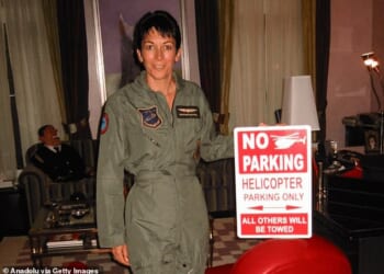 The infamous latex puppet can be seen propped up on a sofa in the background of a photograph showing convicted sex trafficker Ghislaine Maxwell