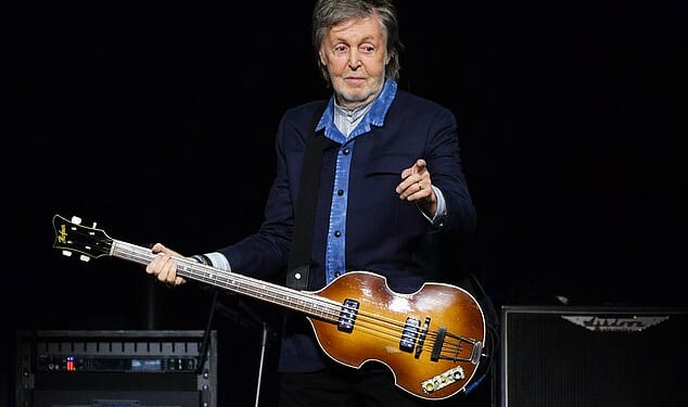 Sir Paul McCartney (pictured in December last year) could face opposition from his neighbour after seeking approval to fell two protected trees at his London home