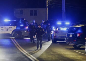 Law enforcement officers secure an area near where the Brown University shooter was reportedly seen in Salem, New Hampshire, on Dec. 18, 2025.