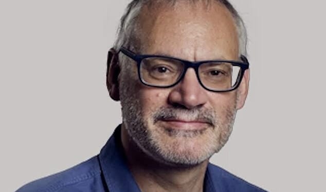 Dr Nick Lagattolia (Pictured) has been told to prove he saved a woman's life or pay a £50 parking fine.