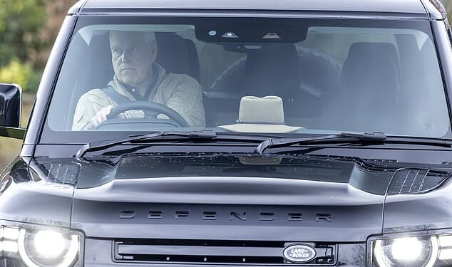 Andrew Mountbatten-Windsor was seen with a solemn expression on his face as he drove his Land Rover defender out of Royal Lodge today