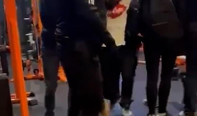 This is the moment Bilel Saadaoui, in a white Lee Cooper t-shirt, was arrested after failing to tell police about his brother's plan to massacre Jews