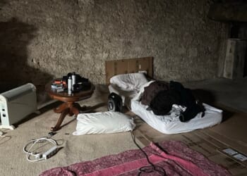 Users are sharing hilarious snaps of their bizarre festive sleeping arrangements on social media - and this image, of a cave-like attic room likened to a 'meth den', has proved the most amusing online