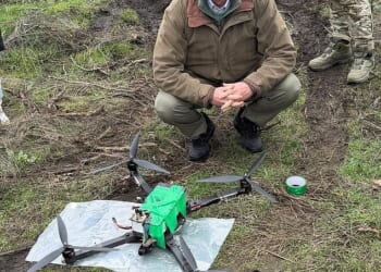 Brooks Newman posing with a drone made by his new defence technology startup, Trypillian