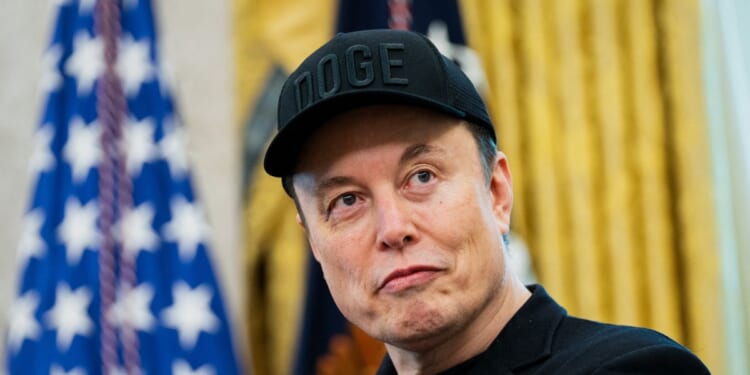 Elon Musk looks on during a news conference with President Donald Trump in the Oval Office of the White House in Washington, D.C., on May 30, 2025.