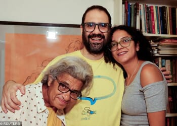 Alaa Abd el-Fattah stands next to his mother, Laila Soueif, and sister, Sanaa, at home in Giza, Egypt