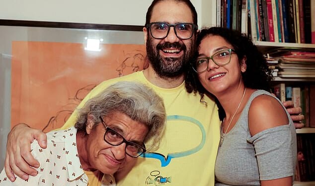 Alaa Abd el-Fattah stands next to his mother, Laila Soueif, and sister, Sanaa, at home in Giza, Egypt