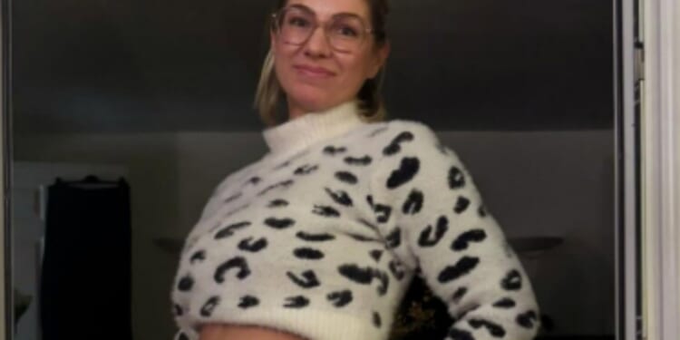 First Dates star reveals she's pregnant as she poses cradling bump