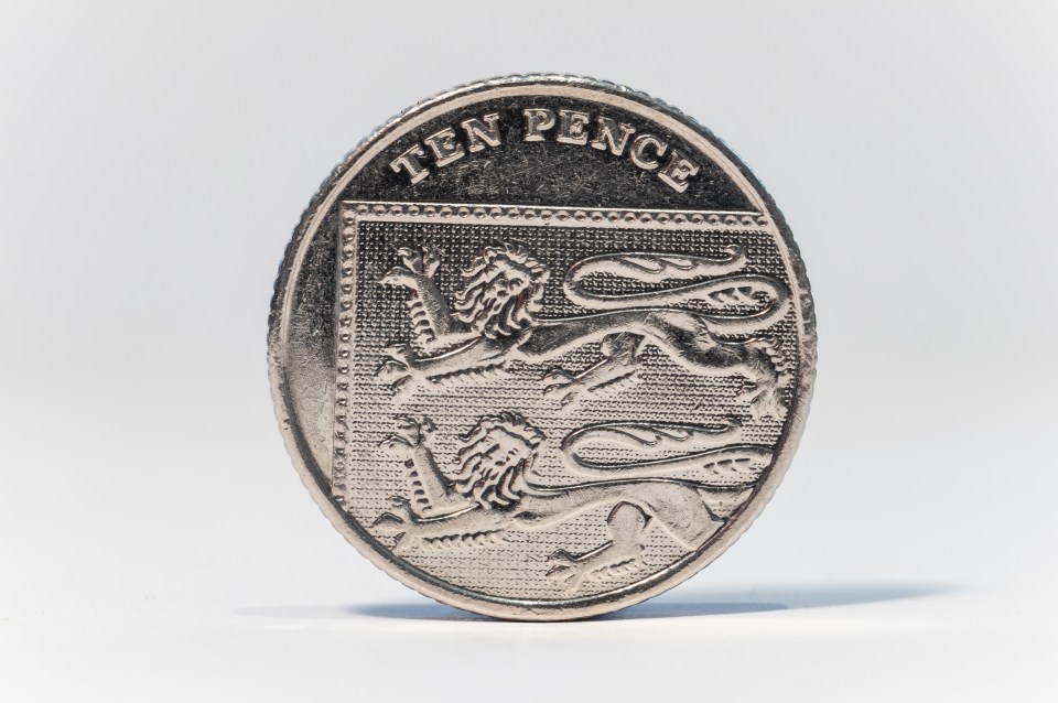 A 10 pence coin with the word "TEN PENCE" at the top and the English royal shield with three lions below it.