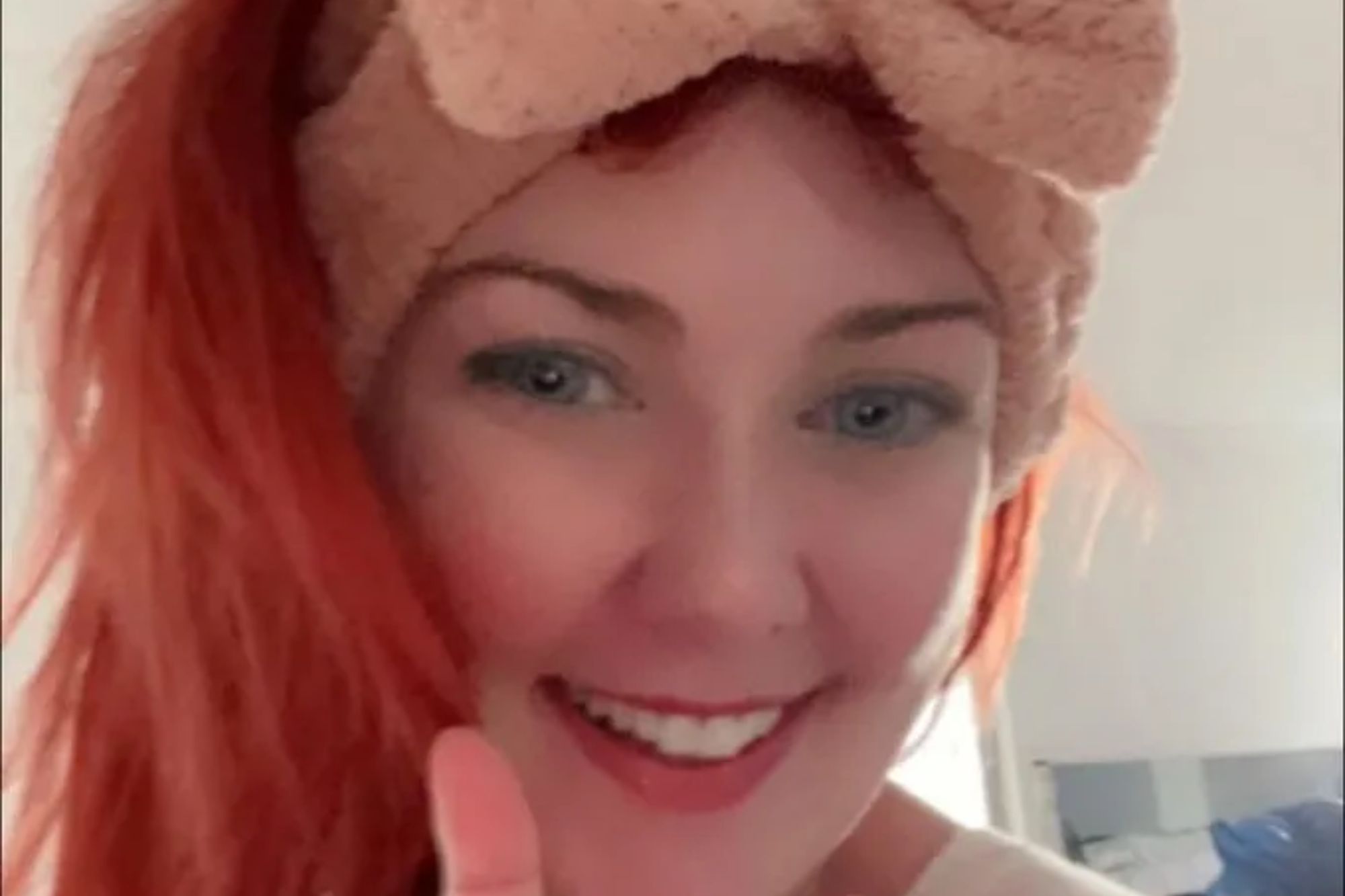 An image collage containing 1 images, Image 1 shows Jennifer Duncan, a woman with blue eyes and bright red hair, wearing a fuzzy pink bow headband