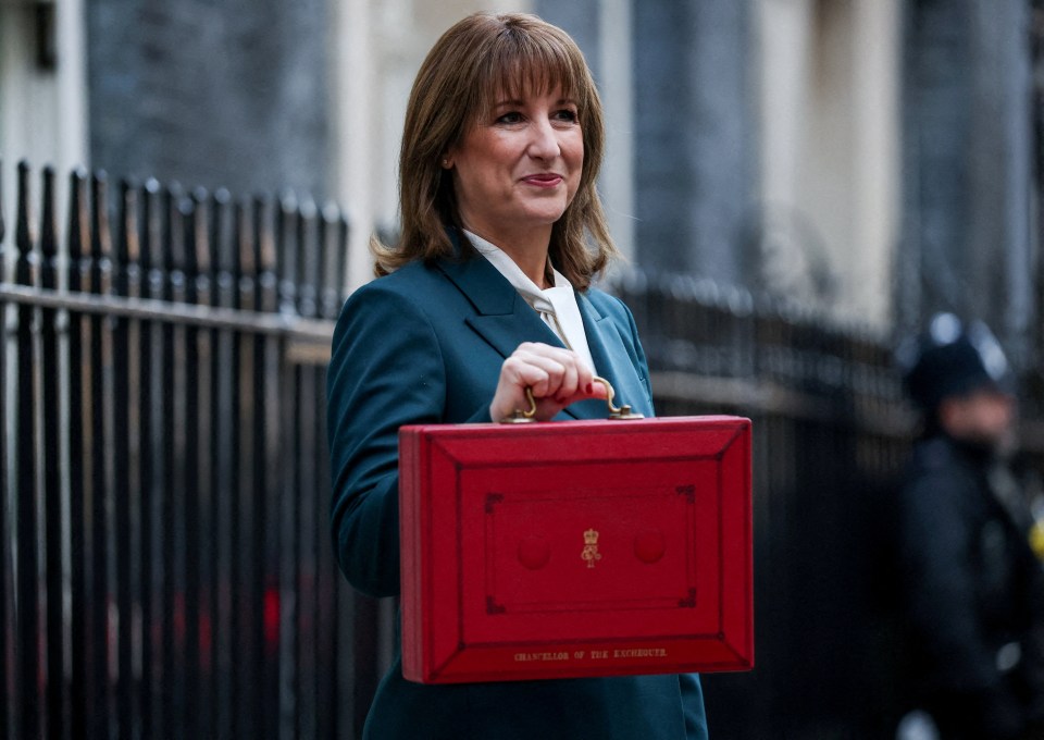 British Chancellor of the Exchequer Rachel Reeves holds the red budget box.