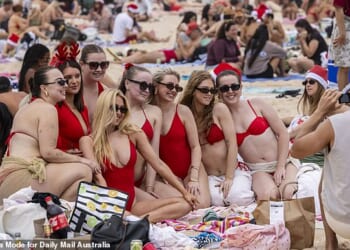 Dozens of Aussies flocked to the beach for Christmas festivities on Thursday