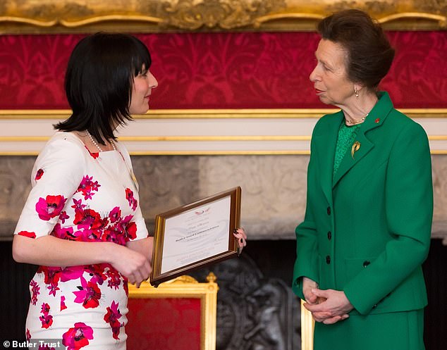 Ms Dixon receiving an award from Princess Anne for helping challenging and vulnerable female prisoners at HMP Holloway