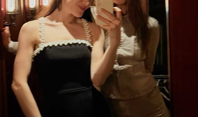 The toxic family feud currently overshadowing Holly Ramsay's imminent wedding to Adam Peaty was brushed aside on Monday evening as they dined with friends out at her father's Mayfair restaurant