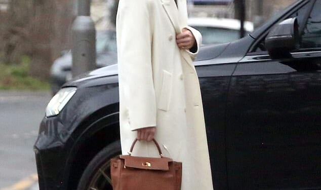 Holly Ramsay, 25, stunned in a white coat as she headed to Bath with her family ahead of her wedding to Adam Peaty amid his family feud