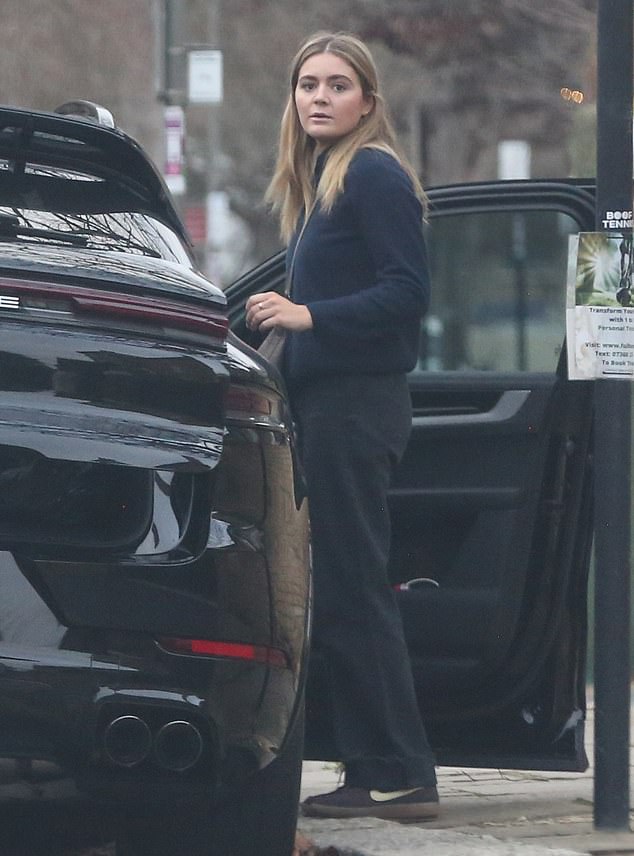 Joining the flock were Holly's sister Tilly, 24, who was snapped in a black ensemble before jumping on a car